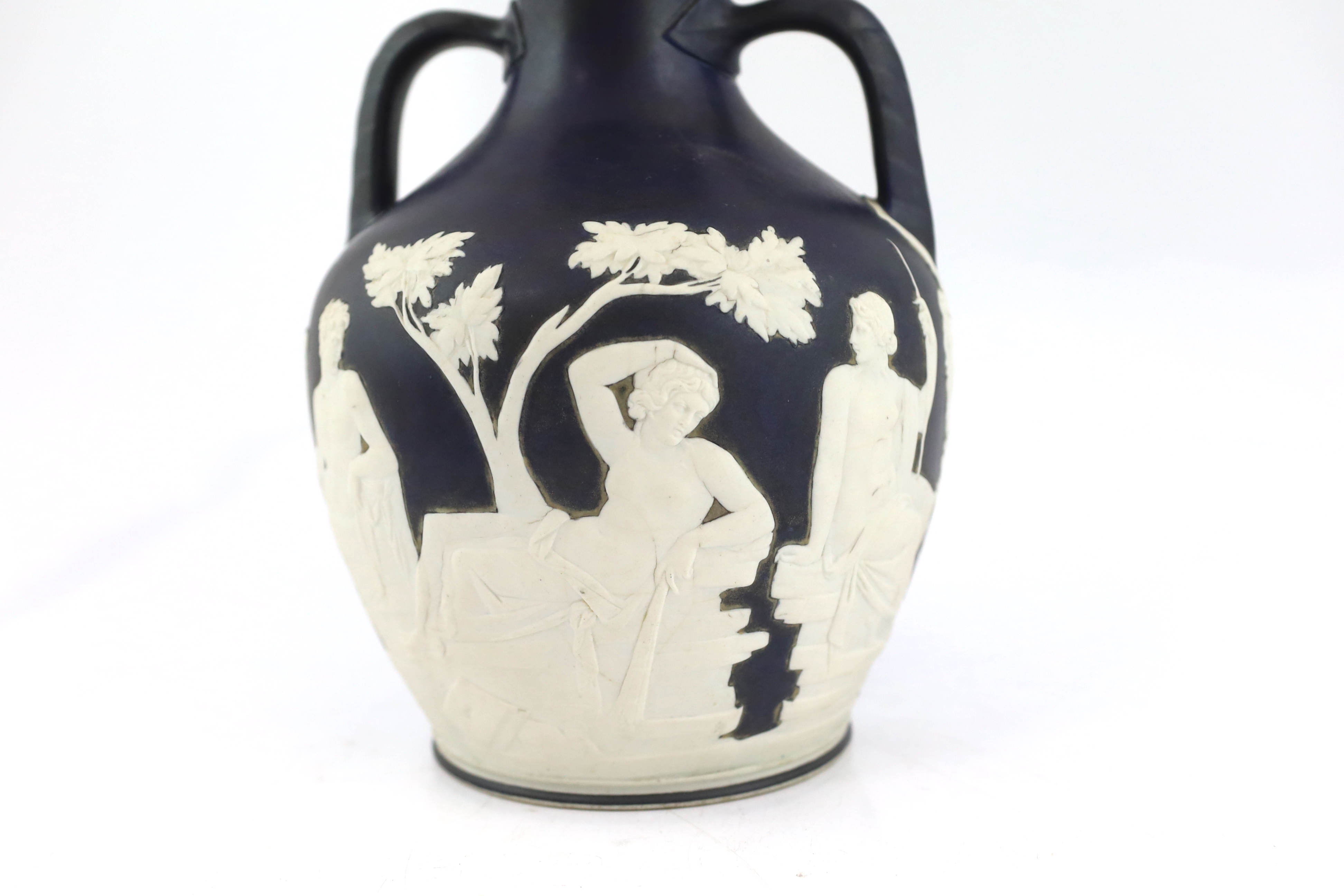 A Wedgwood dark blue glazed and white sprigged replica of the Portland vase, late 19th century